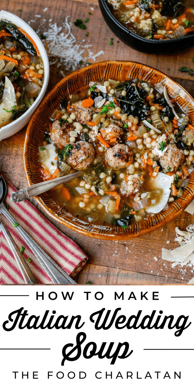 Italian wedding soup in a brown clay bowl with spoon and 2 other bowls of soup in background.