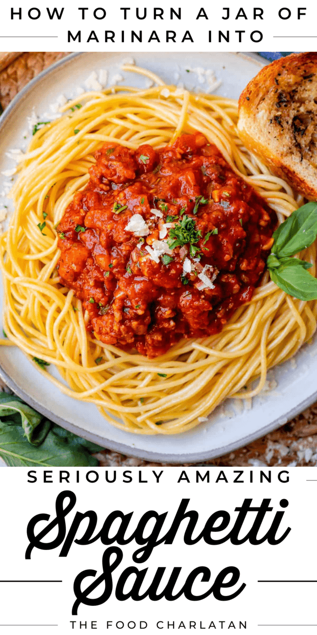 easy spaghetti sauce on a plate with cheese and basil and bread.