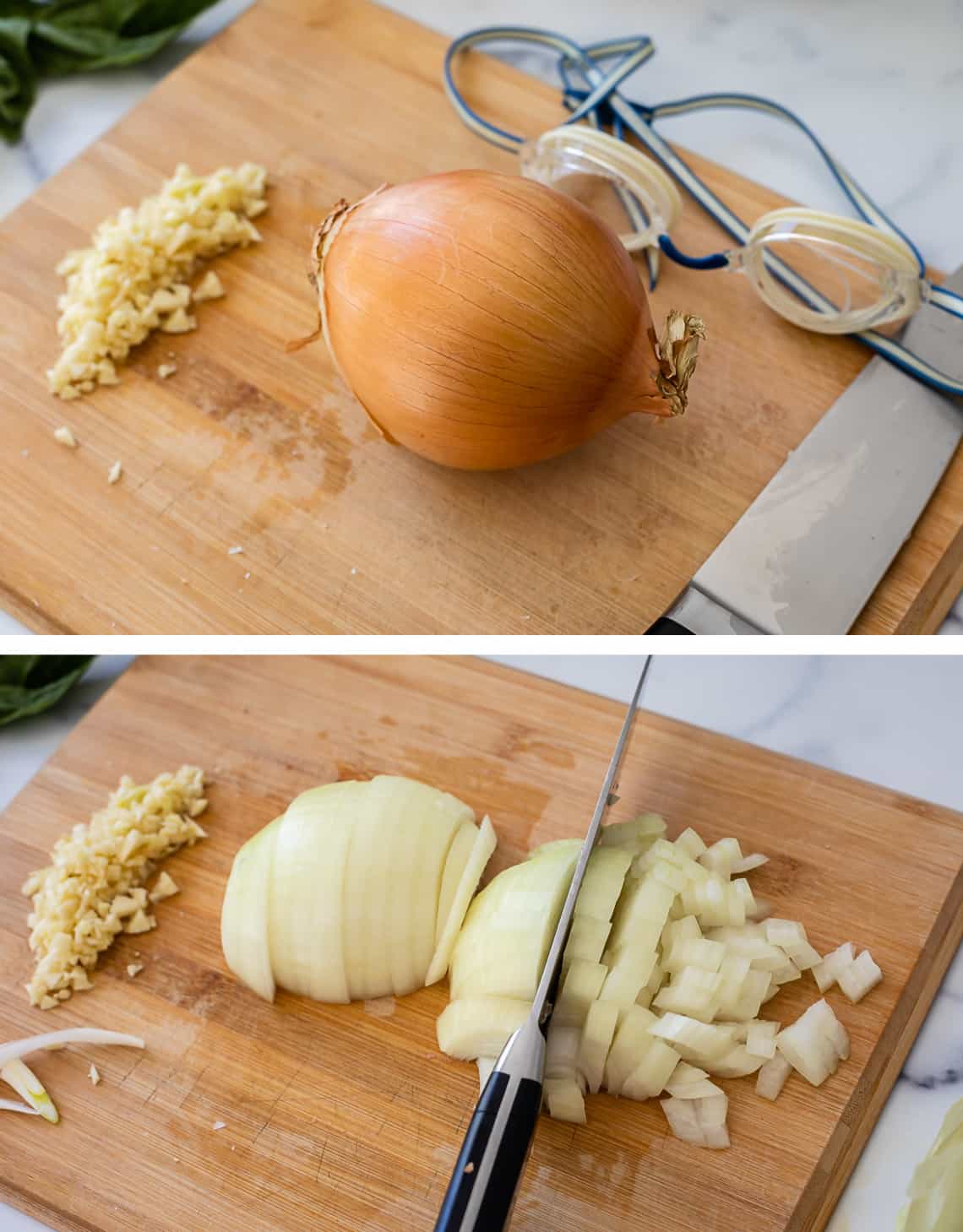 Chopping a yellow onion on a wood cutting board tutorial for how to make spaghetti sauce.