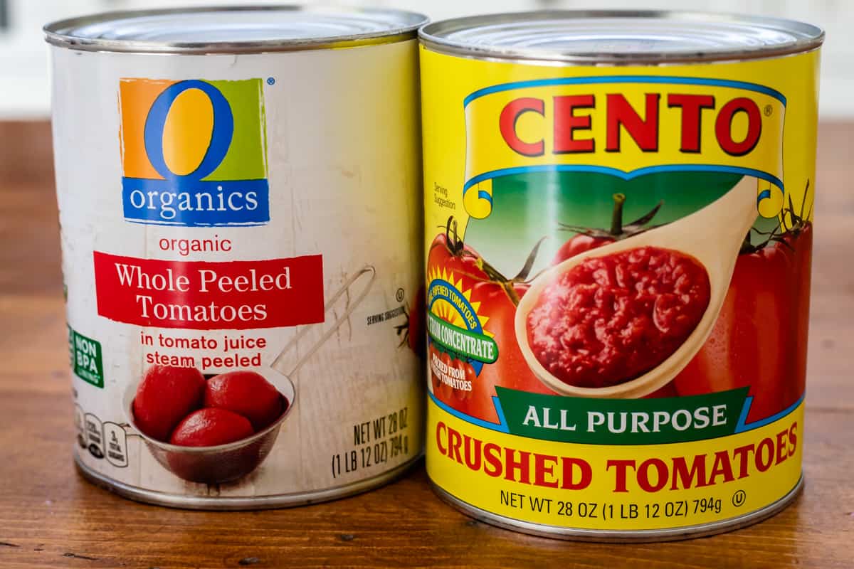 two types of canned tomatoes, one is whole peeled and the other is crushed.