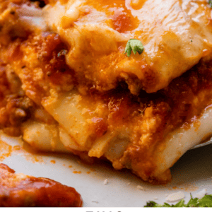 close up of easy lasagna recipe with layers and parsley on top.