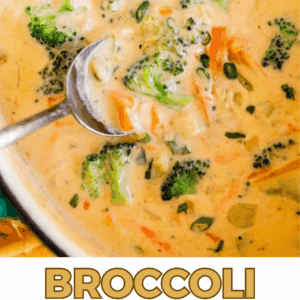 A close-up of creamy broccoli cheddar soup with broccoli florets, shredded carrots, and melted cheese in a pot with a spoon. Text below reads, “Broccoli Cheddar soup – The Food Charlatan.”.