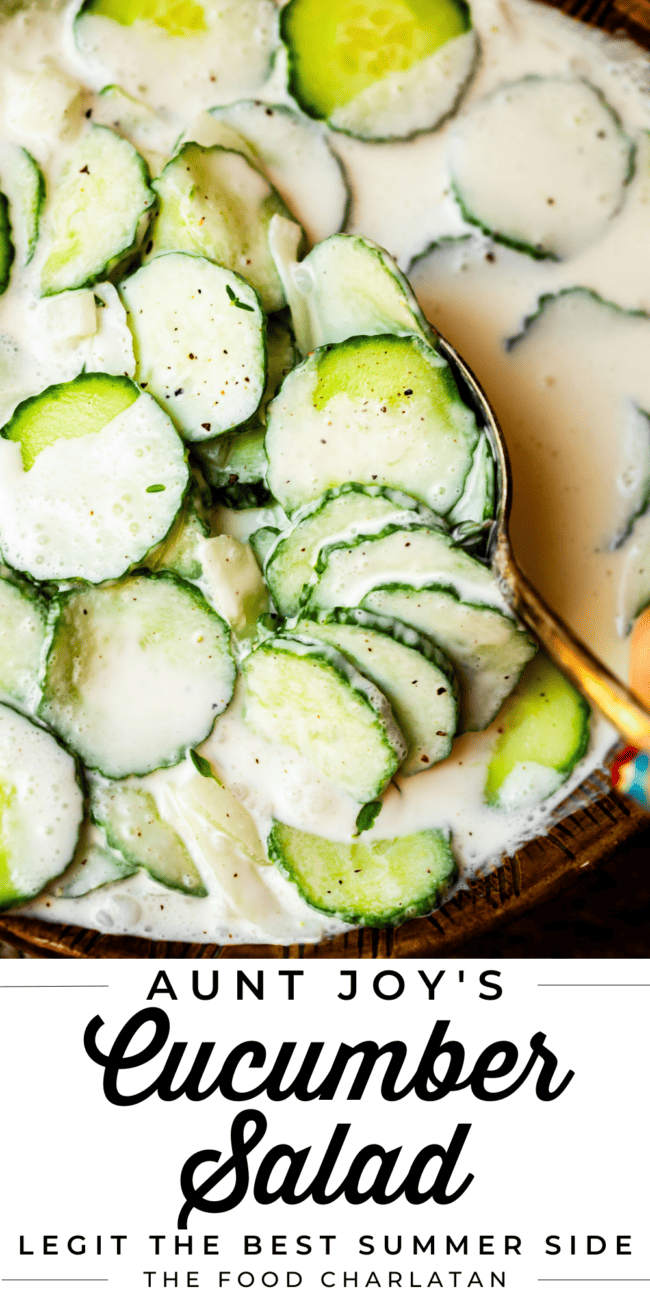 creamy cucumber salad recipe in a bowl with a spoon.