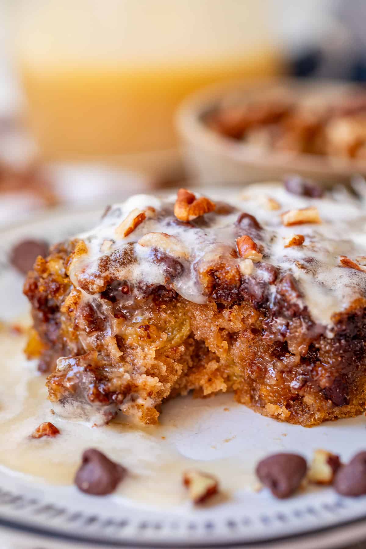 horizontal close up of a piece of picnic cake with a bite take out of it.