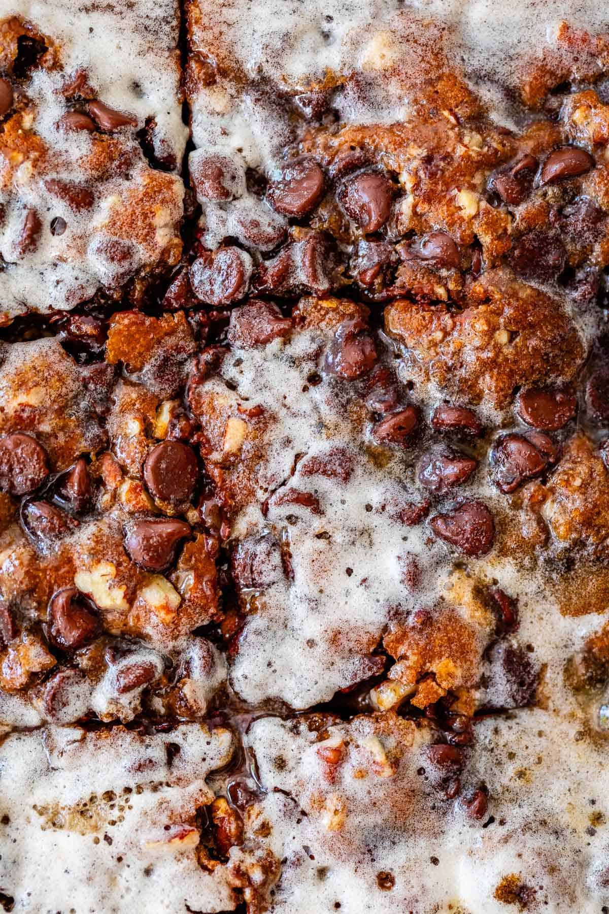 overhead close up of cut picnic cake with buttermilk glaze soaked into it.