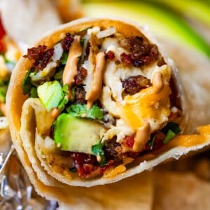 horizontal shot of breakfast burrito with chipotle mayo.