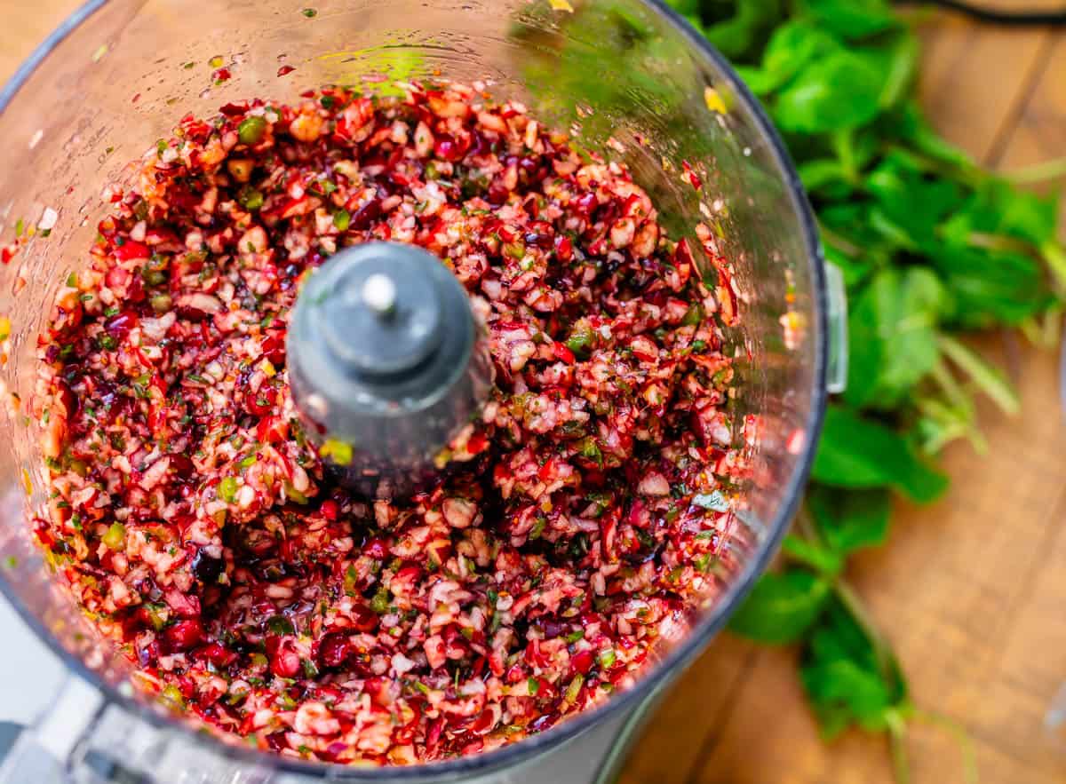 diced ingredients for cranberry jalapeño dip in food processor.