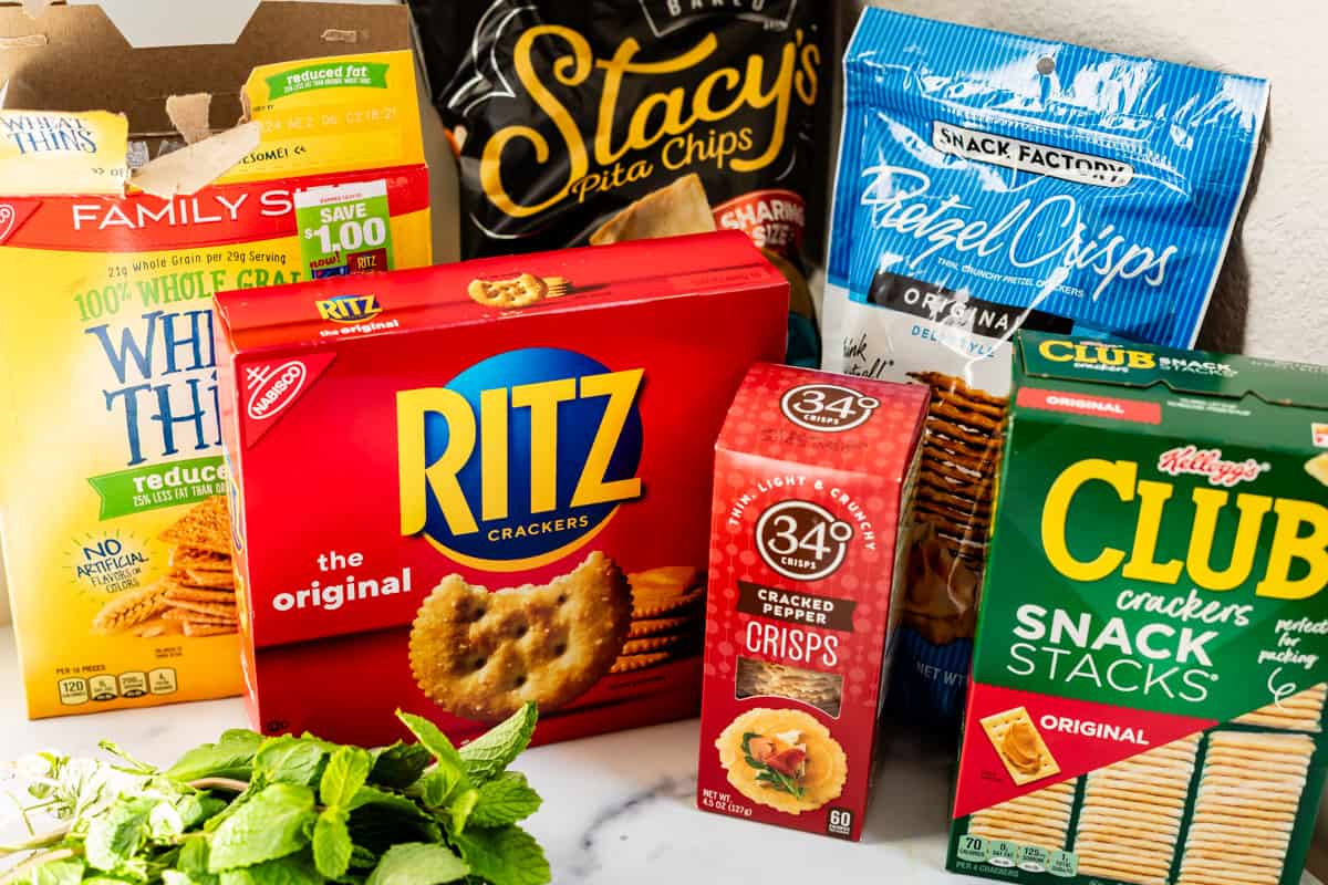 multiple crackers for dipping including ritz, club, wheat thins, crisps, and more.