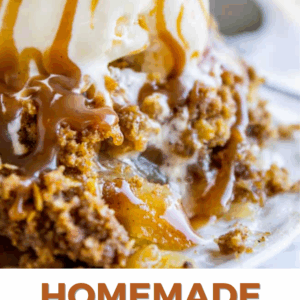 A close-up of apple crisp topped with streusel, a scoop of vanilla ice cream, and drizzled caramel sauce. Text below reads: Apple Crisp Recipe with Streusel. The Food Charlatan.