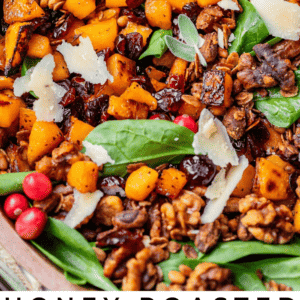 overhead shot of butternut spinach salad with fresh cranberries and sage.