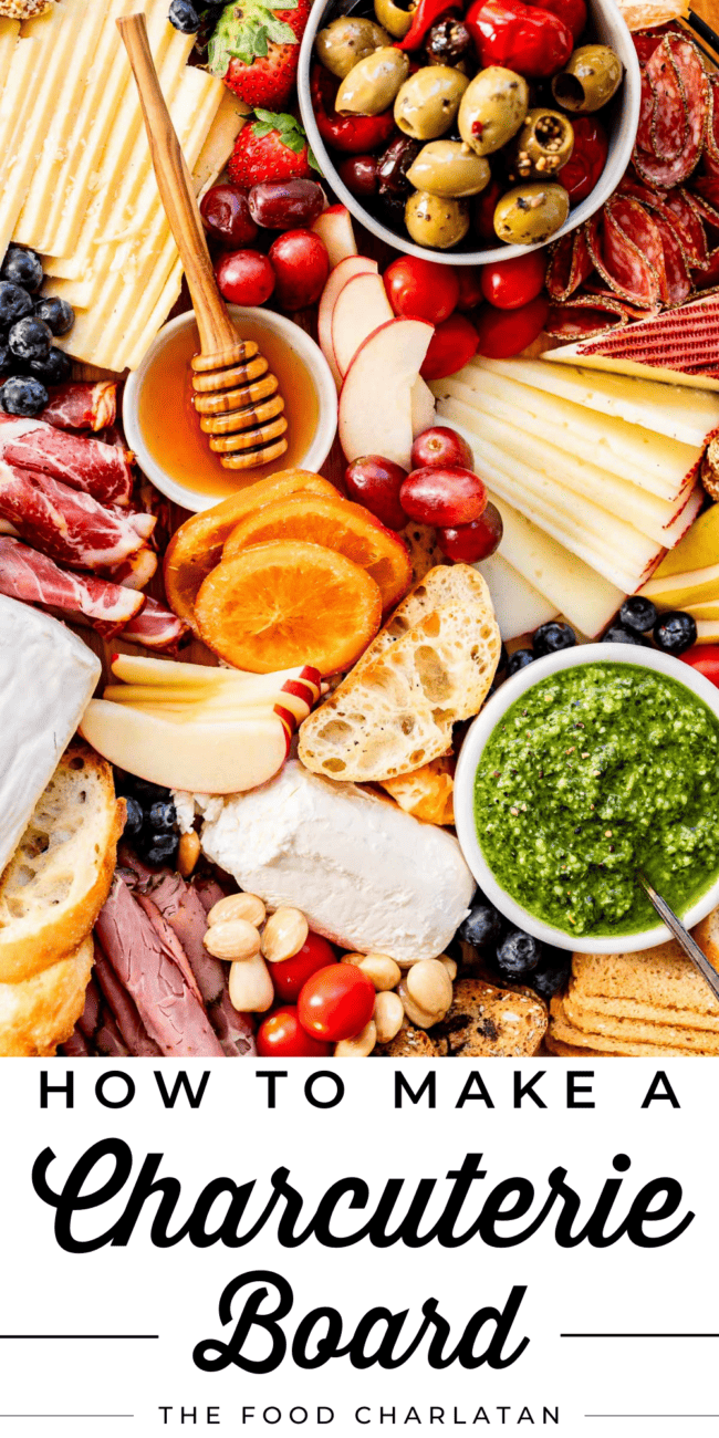 how to make the best charcuterie board with tons of ideas - cheese, pesto, apple, bread, honey, olives, etc.