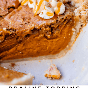 homemade sweet potato pie with praline topping and caramel whipped cream garnish.