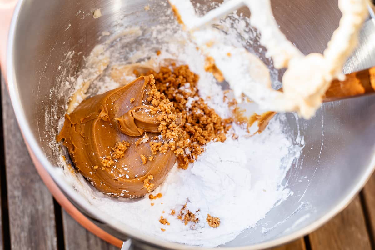 peanut butter added into the mixing bowl with the other ingredients ready to be mixed.