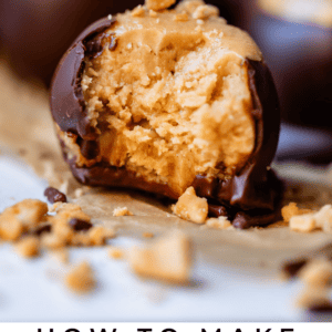 Close-up of buckeye candy with bite taken out revelaing crumbly and moist peanut butter entrance.