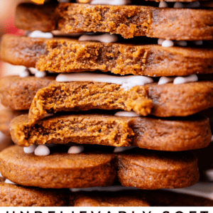 stack of chewy gingerbread cookies with bites taken out.