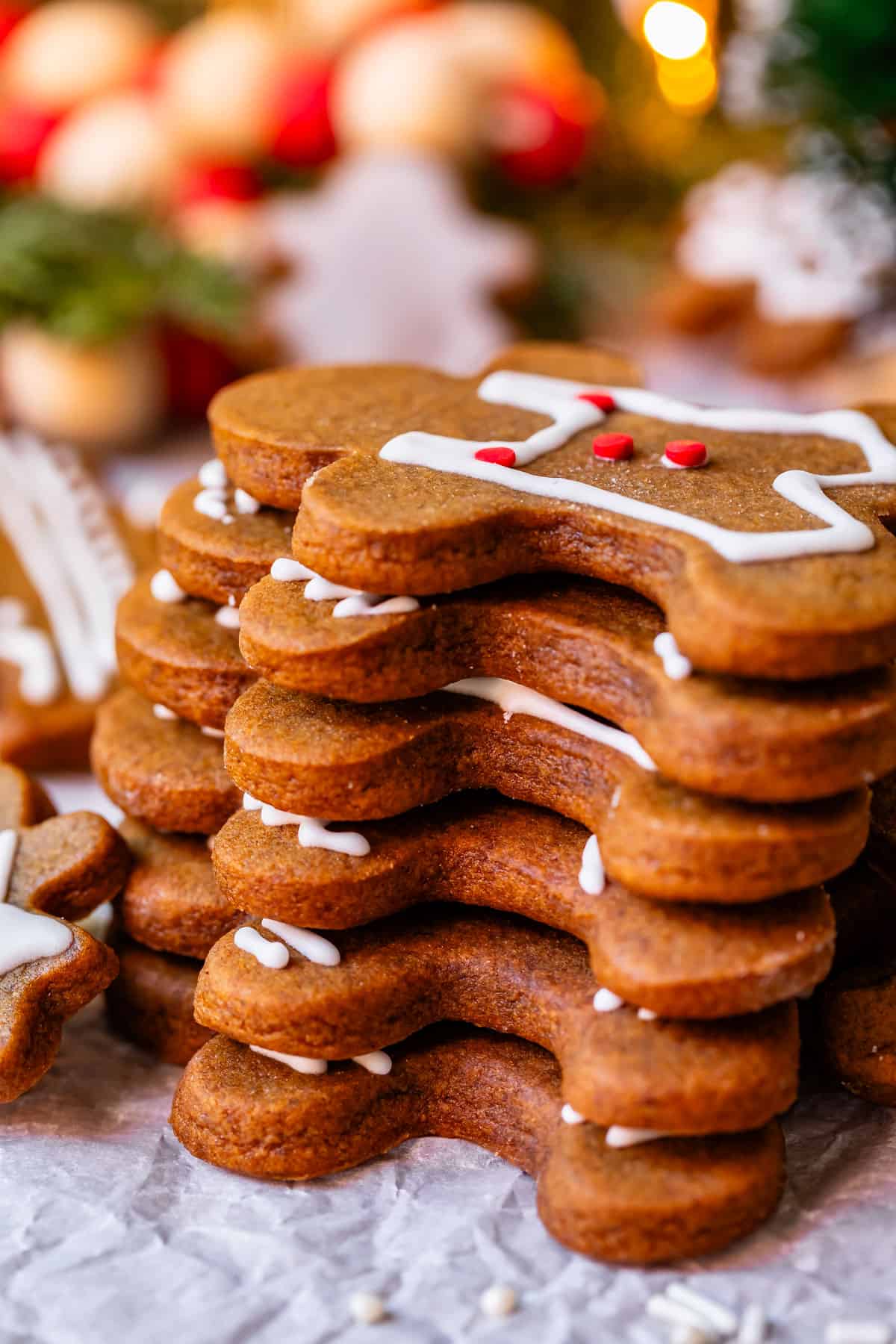 stack of gingerbread men with royal icing.