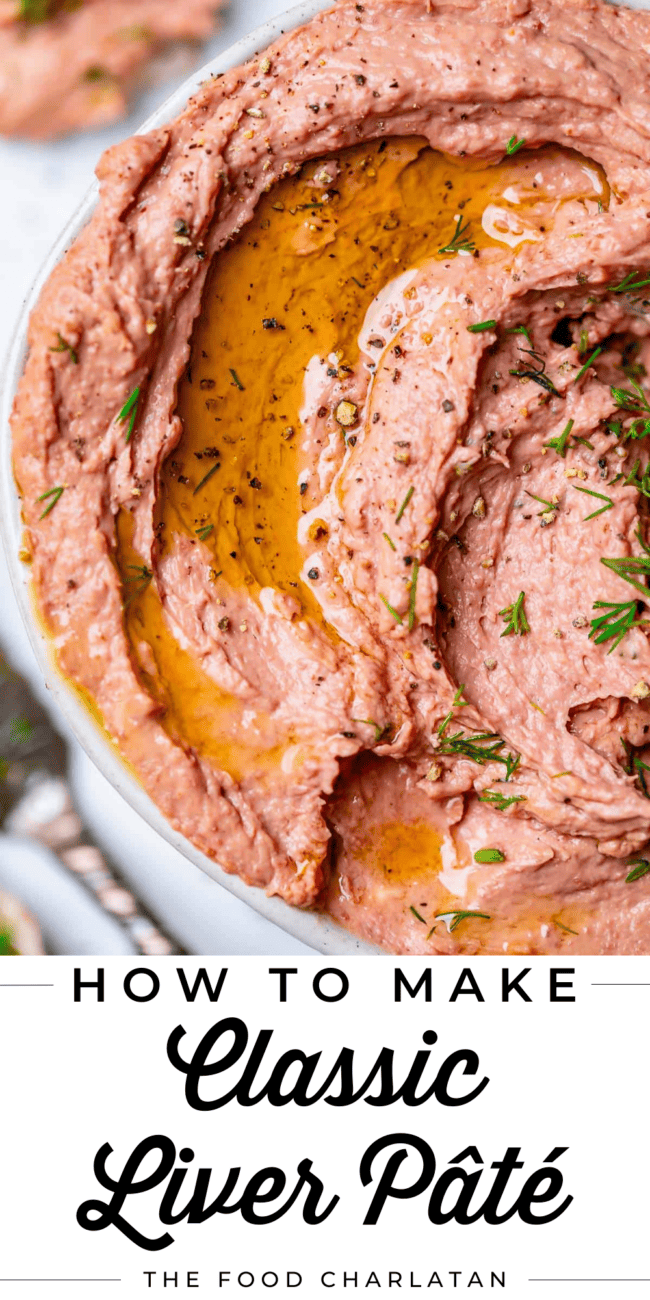 Liver pate swirled in a bowl sprinkled with dill and oil.