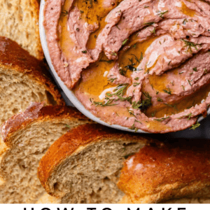 Live pate in a bowl with oil and rye bread on the side.