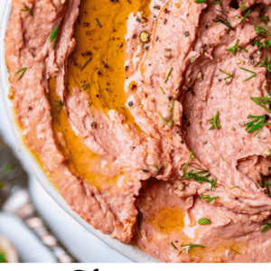 liver pate swirled in a bowl with oil on top.