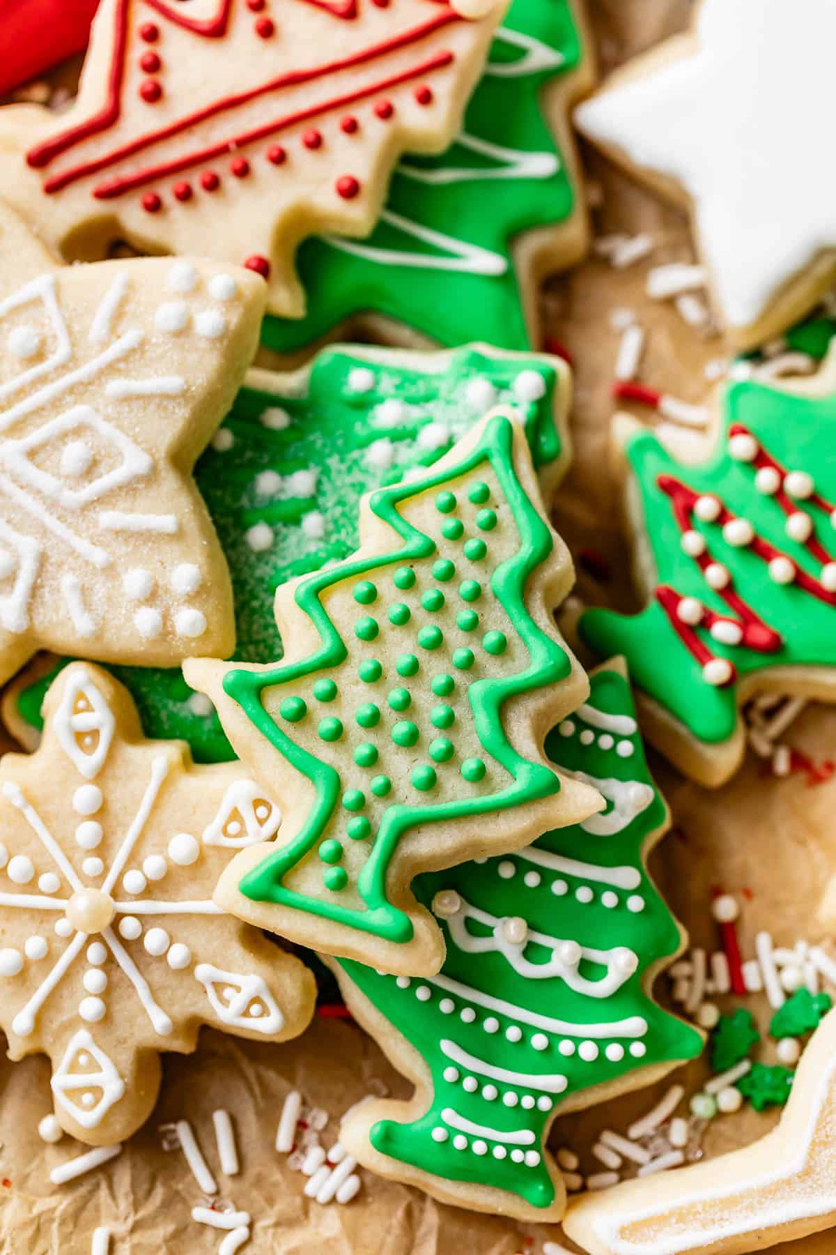 Decorated Christmas holiday cookies including tree, snowflake, and stars.