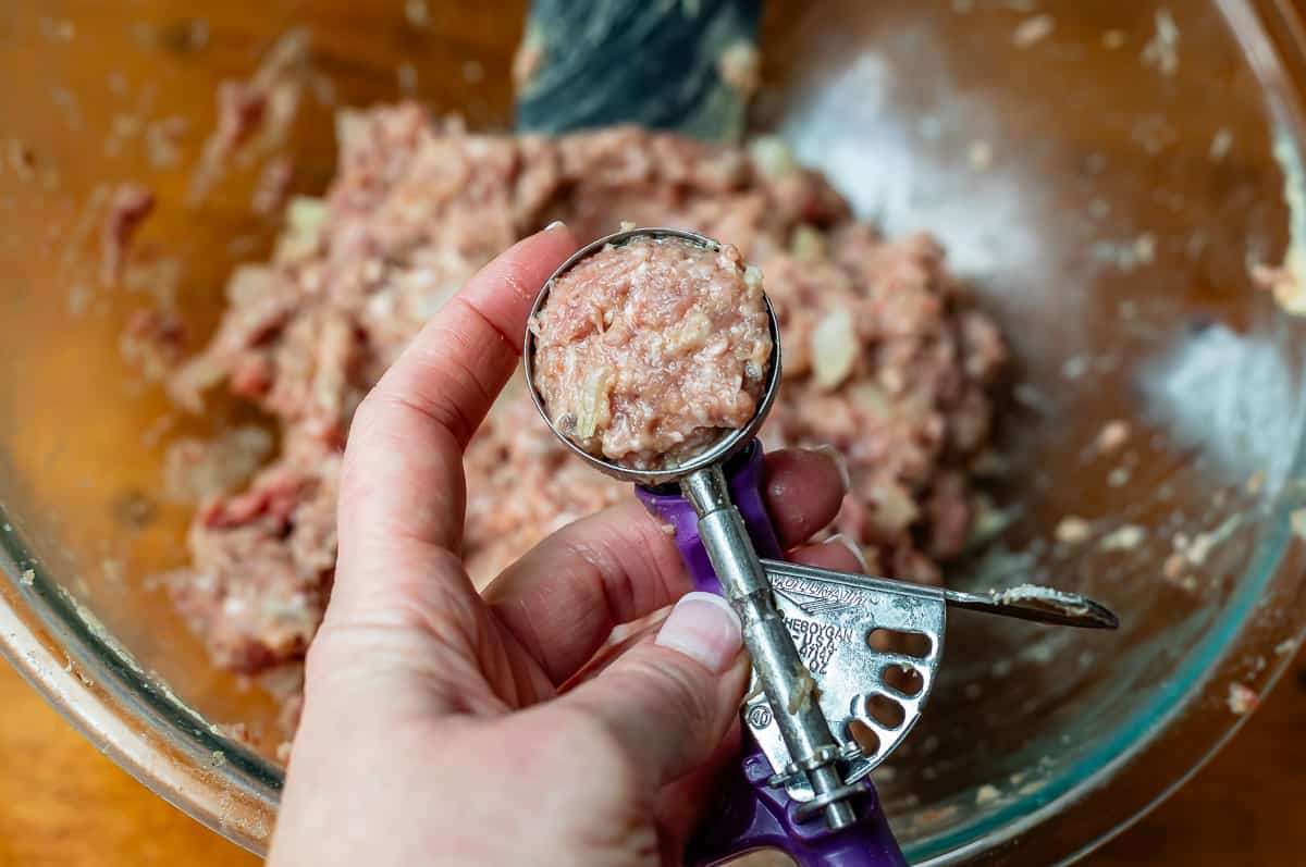 uncooked meatball mixture in a small cookie scoop to get the correct size.