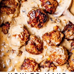 Browned Swedish Meatballs in a white pan with a spoon.