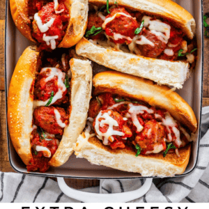 toasted hoagie meatball subs in a baking dish with text "extra cheesy meatball sandwiches".