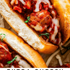 close up shot of a meatball sub with text "extra cheesy meatball sandwiches".