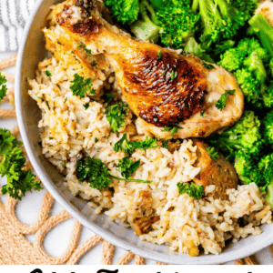 chicken drumstick in a bowl with rice and broccoli.