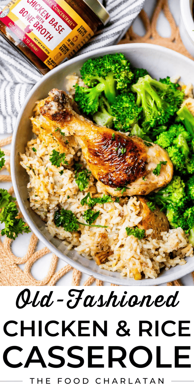 chicken drumstick in a bowl with rice and broccoli.