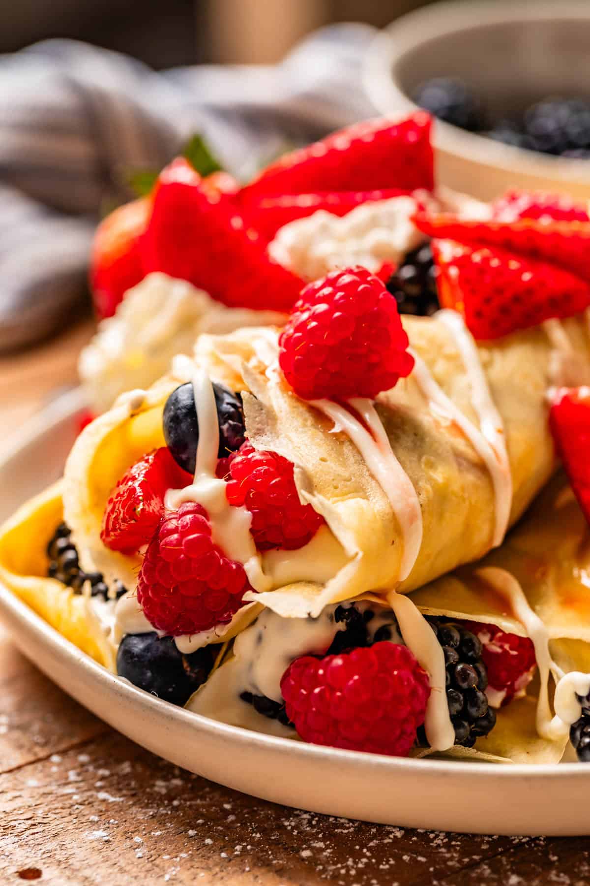 crepes filled burrito style with cream cheese spread and fresh mixed berries.