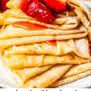 pinterest image of crepes topped with strawberries and text "truly the best crepes I've ever had".
