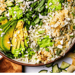 pinterest image of green goddess salad with text "creamy dreamy green goddess salad".