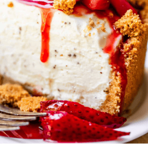 no bake cheesecake with strawberry topping and a fork.