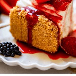 slice og no bake cheesecake with strawberries on top.