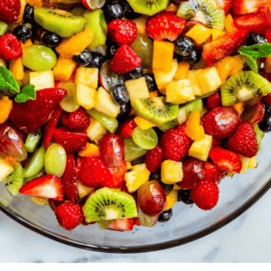 pinterest image of mixed fruit salad with text "my tips for the best fruit salad of your life".