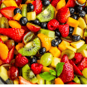 pinterest image of mixed fruit salad with text "my tips for the best fruit salad of your life".
