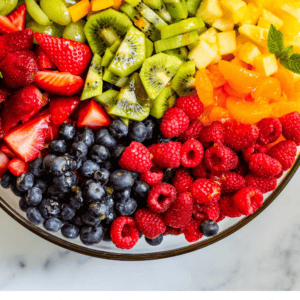 pinterest image of bowl with fruit salad and text "tips for the best fruit salad".