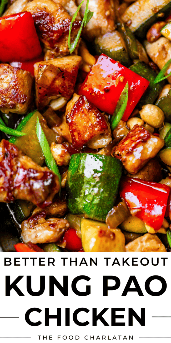 Pin image of kung pao chicken close up with chunks of perfectly searched chicken and veggies.