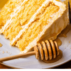 pinterest image of cake with text "cornbread cake with honey butter".
