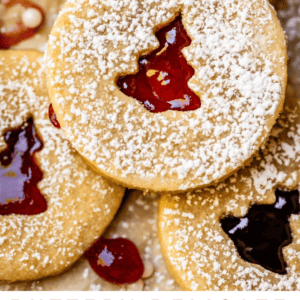Pinterest image of butter cookie with christmas tree cut out and jam.
