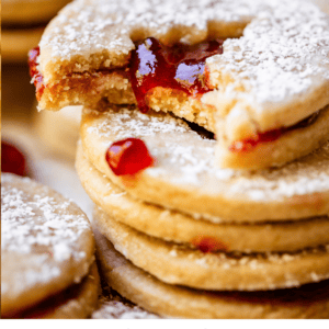 bite taken out of jam filled linzer cookies.