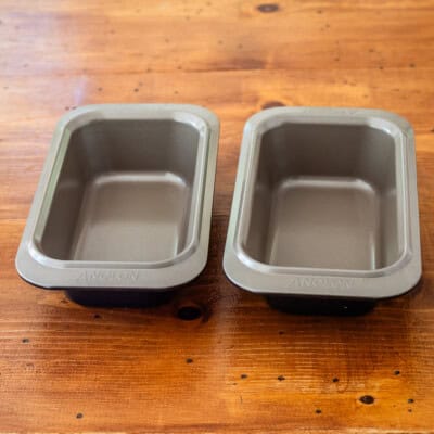 Analon loaf pans on wooden table.