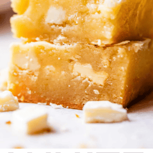 two white chocolate brownies stacked.
