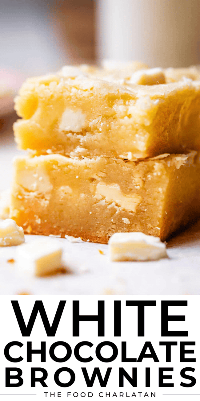 two white chocolate brownies stacked.