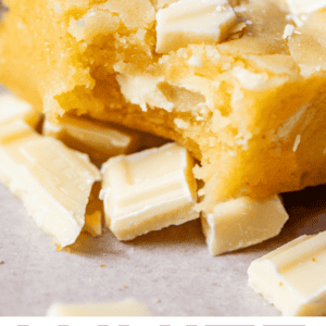 white chocolate bar sitting on chopped white chocolate.