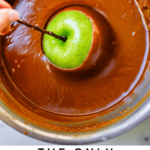 swirling a green apple in caramel, shot from overhead.