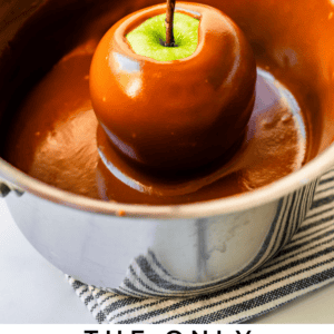 pin image of dipping a green apple in a silver pot of caramel.