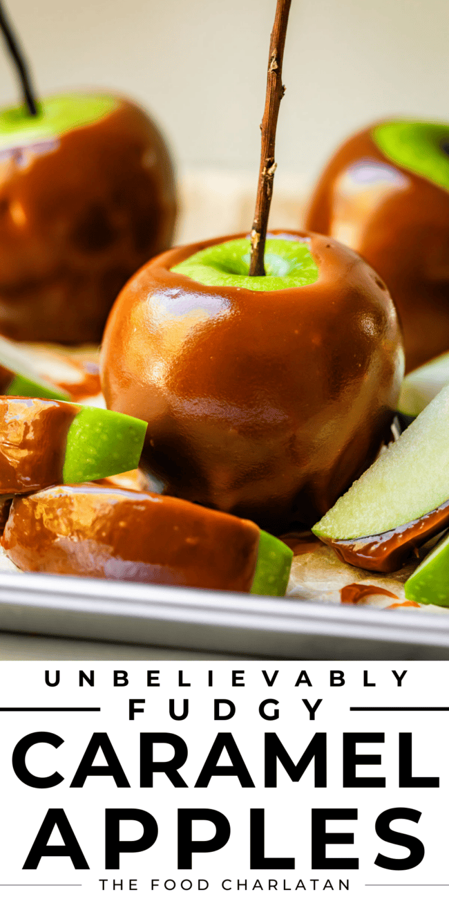 Caramel apple on a pan with sliced caramel apples around it.