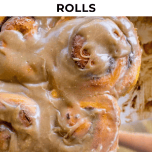 Close-up of pumpkin cinnamon rolls coated in glossy cinnamon glaze, with text above reading Easy One Hour Pumpkin Cinnamon Rolls.